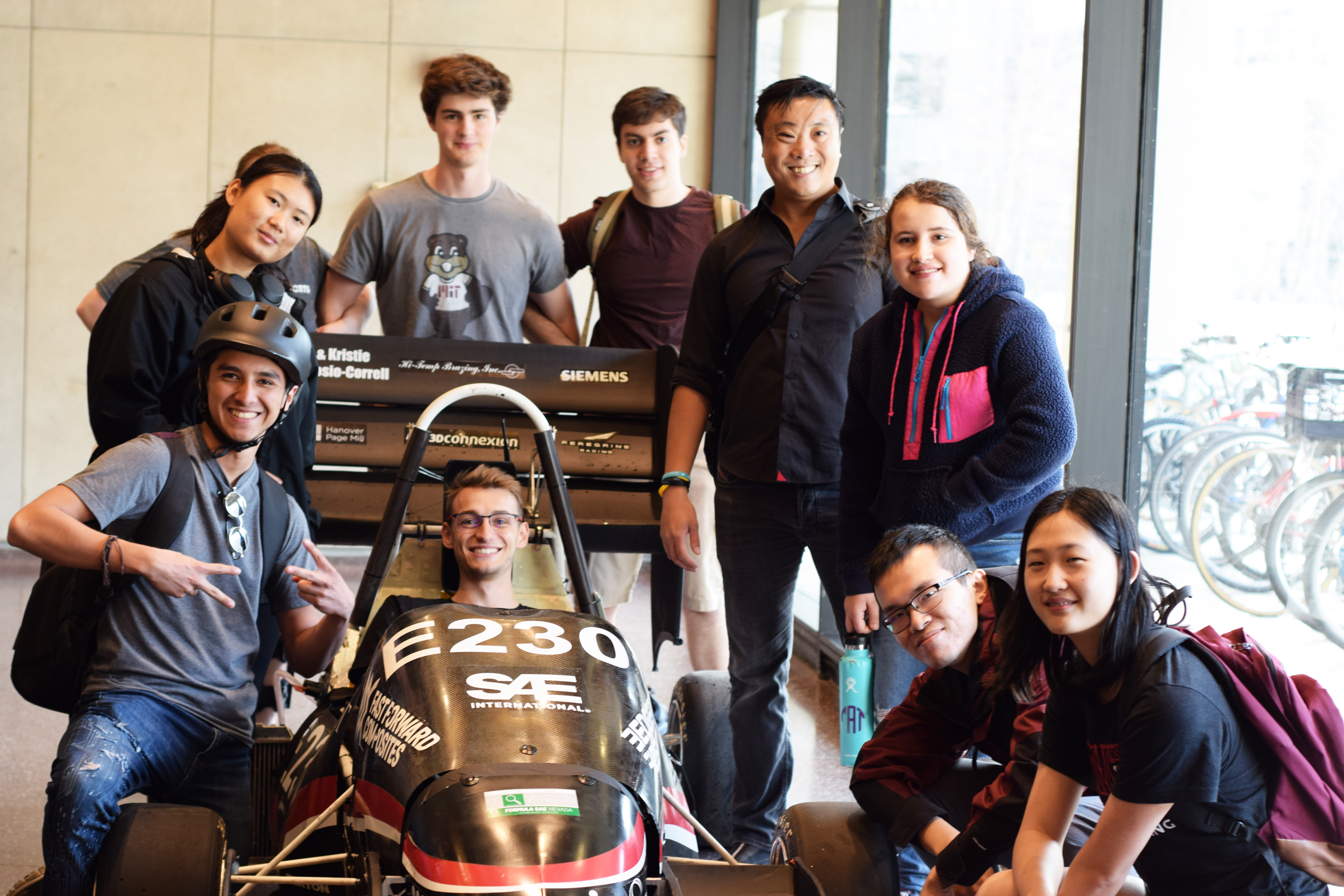 Members of Motorsports Team and Motorsports founding member Alex Soo '08 posing with their car.