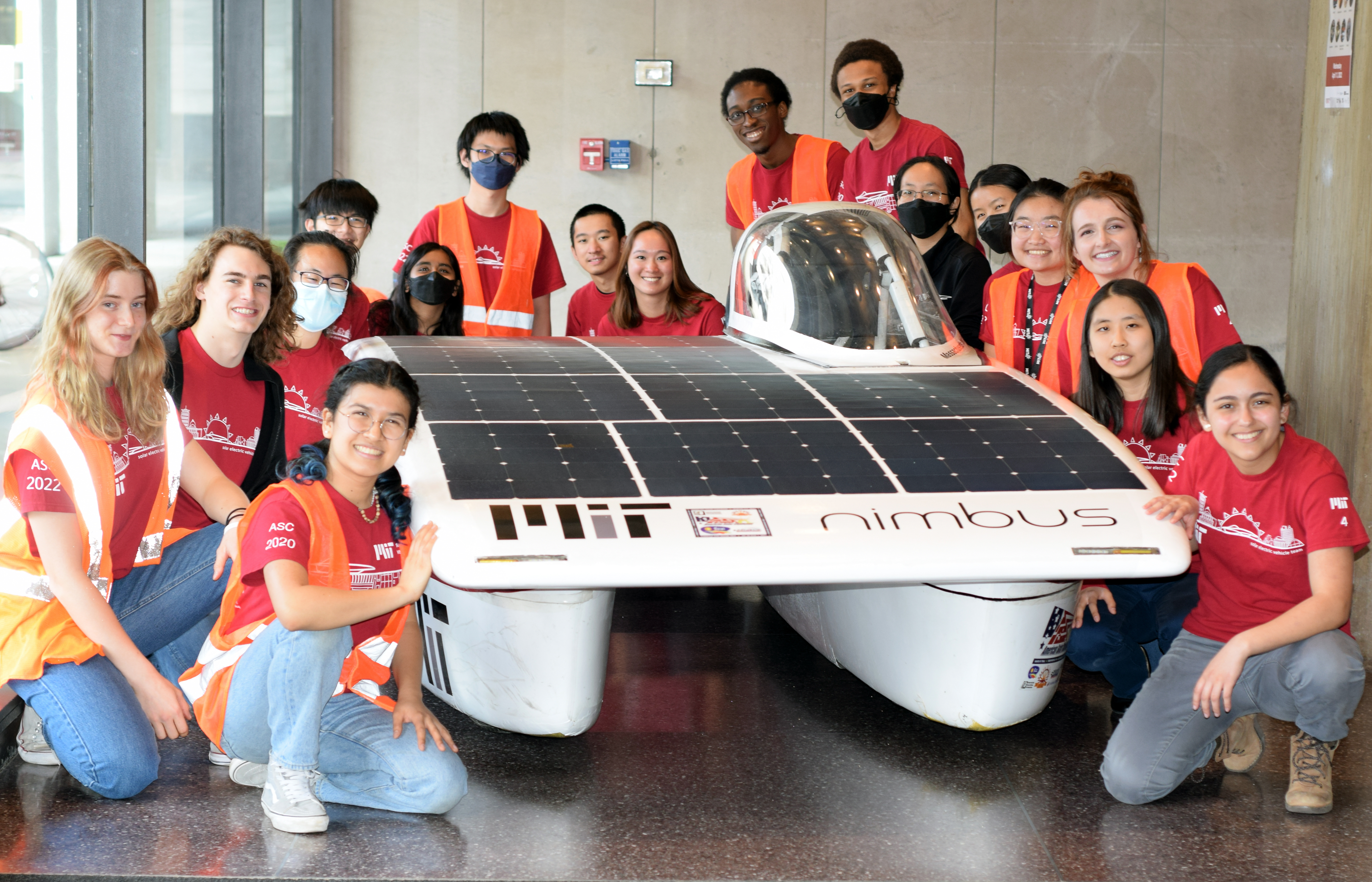 Members of SEVT posing with their car.