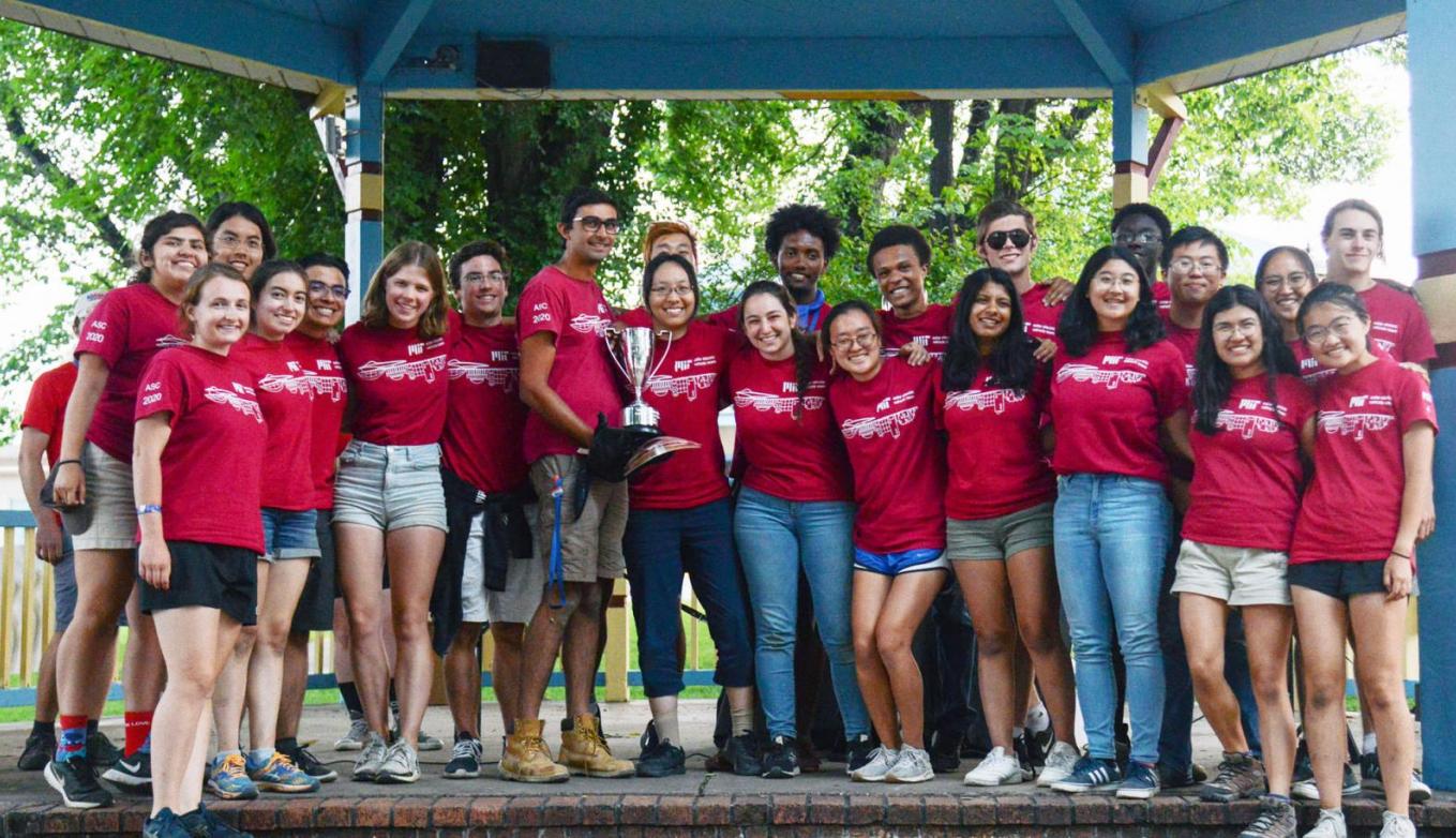 The MIT Solar Electric Vehicle Team poses with 2021 American Solar Challenge Trophy