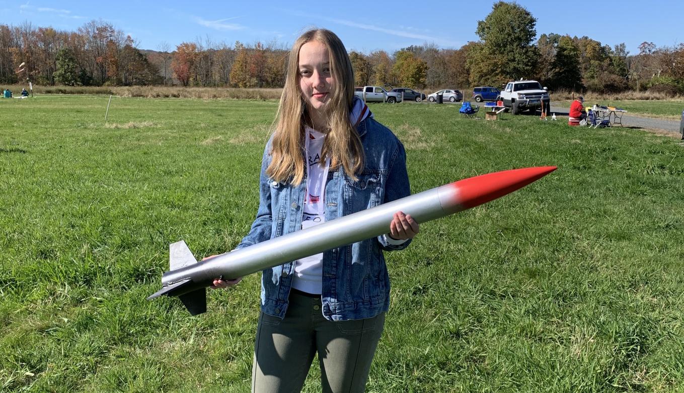 Summer Hoss ‘23 holding a rocket