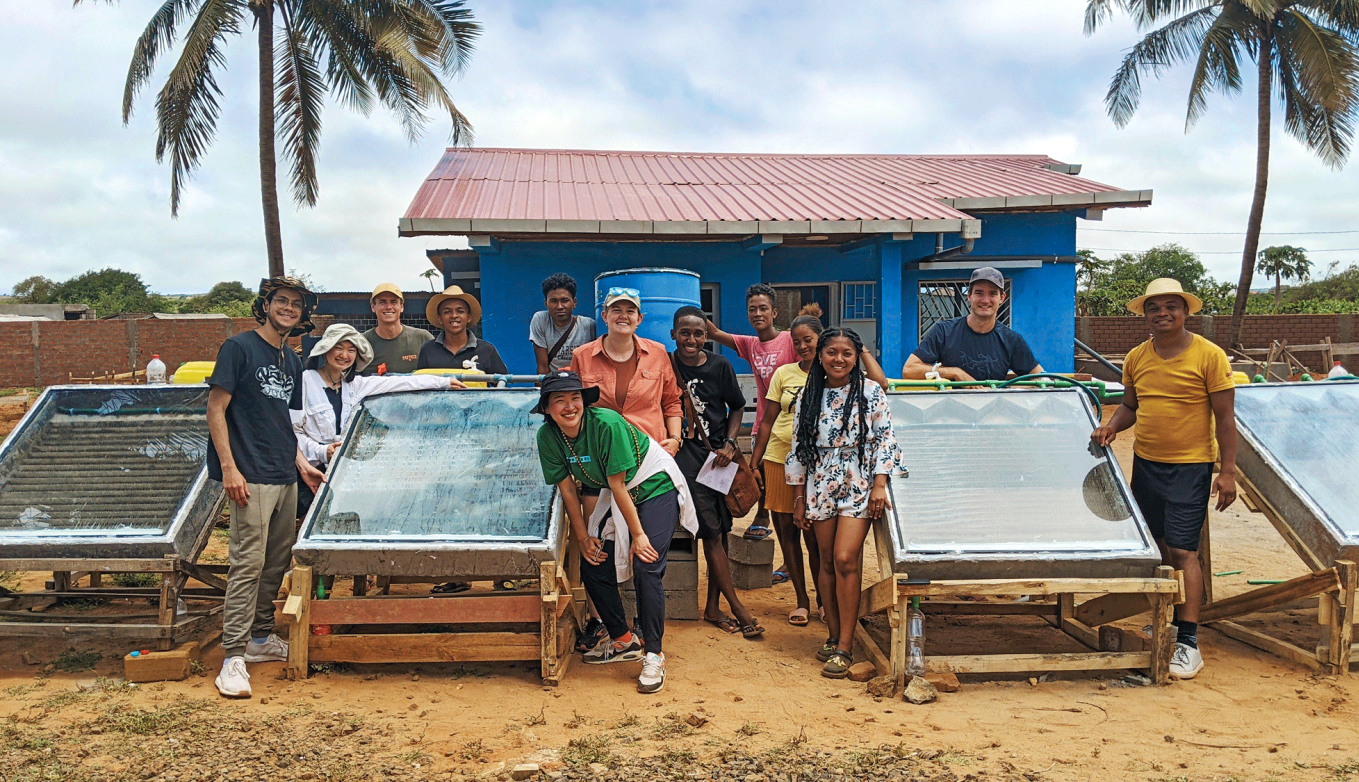 College students and their solar panels in the field