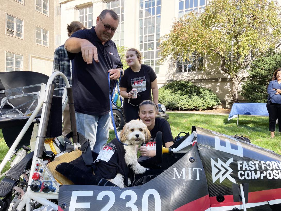 McAtamney with his dog Max and Motorsports team members